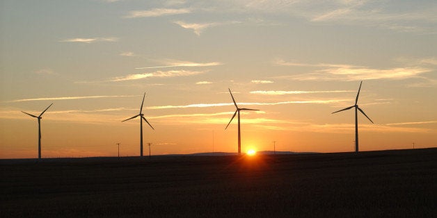 WASCO, OR - NOVEMBER 16: The sun sets beyond turbines in the recently completed Klondike II wind farm, expected to produce enough electricity to power about 26,400 homes a year, November 16, 2005 near Wasco, Oregon. The plant consists of 50 1.5-megawatt wind turbines, and is located on 6,400 acres of farmland. The land is leased by eight local landowners, who continue to use the land for farming. The new wind power plant represents Oregon's continued support of the development of renewable energy. (Photo by Melanie Conner/Getty Images)