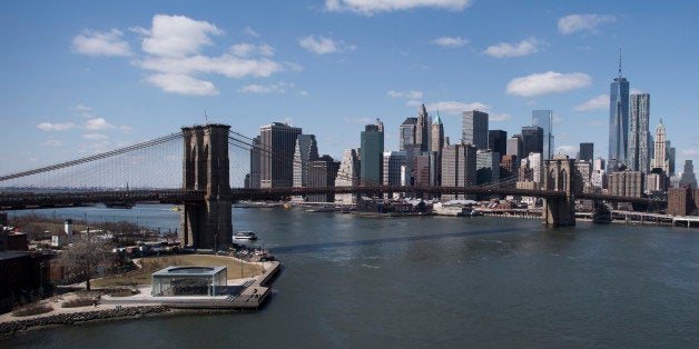 NEW YORK, NY - MARCH 29: The New York City skyline is seen behind the Brooklyn Bridge on March 29, 2014 in New York City. (Photo by Timur Emek/Getty Images)