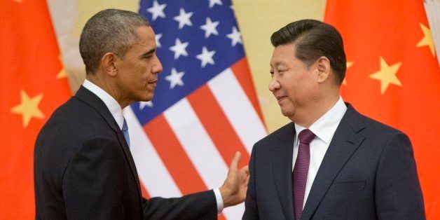 U.S. President Barack Obama, left, and Chinese President Xi Jinping shake hands following the conclusion of their joint news conference at the Great Hall of the People in Beijing, Wednesday, Nov. 12, 2014. (AP Photo/Pablo Martinez Monsivais)