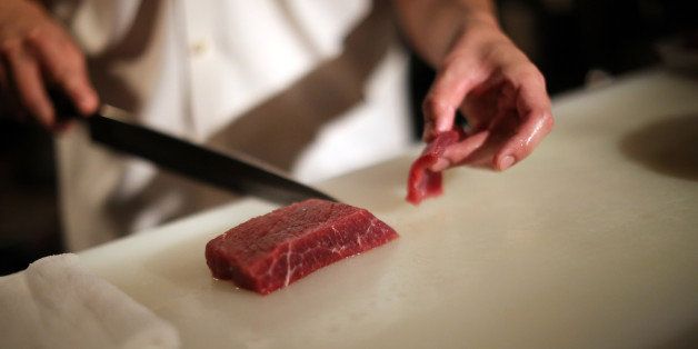 In this Sept. 11, 2014 photo, chef of the Japanese restaurant "COM FOR TABLE" slices whale meat for a dish in in Tokyo. Whale meat continues to be one of the favorite dishes in this restaurant, but restaurant manager concerns about the future of its supply. At the International Whaling Commission meeting in Slovenia which opens Monday, Sept. 15, 2014, Japan is expected to seek international support for its plans to hunt minke whales in the Antarctic Ocean next year by scaling down the whaling research program the U.N. top court rejected earlier this year. The restaurant manager is hoping that supply will continue to sustain the demand for whale meat which has been a staple for the Japanese for such a long time. (AP Photo/Eugene Hoshiko)
