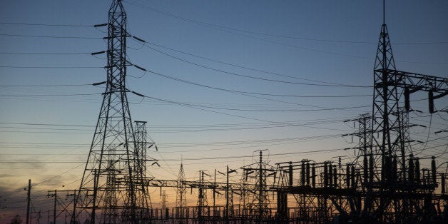 The silhouette of a transmission tower is seen holding power lines in Niagara Falls, New York, U.S., on Thursday, Sept. 25, 2014. The Niagara Falls State Park, established in 1885, saw a 1.9 percent increase in visitors in 2013 compared to 2012 with over 8.8 million tourists visiting in 2013. Photographer: Andrew Harrer/Bloomberg via Getty Images