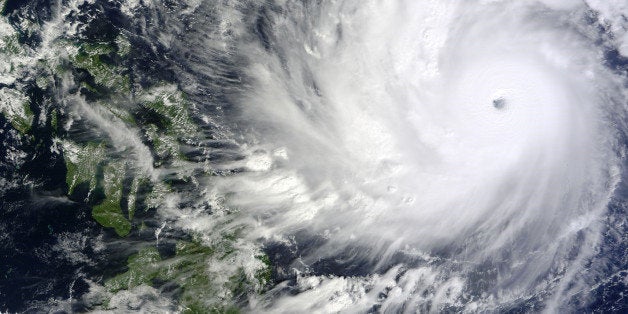 This image captured by the MODIS instrument aboard NASA's Terra satellite shows Typhoon Hagupit on Thursday, Dec. 4, 2014, at 02:10 UTC, as it approaches the Philippines. Villagers are fleeing coastal towns in the central Philippines as the advancing storm evokes memories of last year's deadly typhoon. Forecasters say Typhoon Hagupit may hit some of the same places devastated by Haiyan in 2013. (AP Photo/NASA Goddard MODIS Rapid Response)