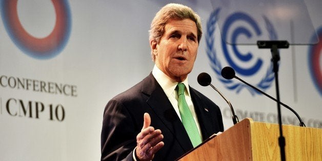 US Secretary of State John Kerry delivers a speech in Lima on December 11, 2014, during the UN 20th session of the Conference of the Parties on Climate Change and the 10th session of the Conference of the Parties serving as the Meeting of the Parties to the Kyoto Protocol being held from December 1st to 12th in Lima. AFP PHOTO/CRIS BOURONCLE (Photo credit should read CRIS BOURONCLE/AFP/Getty Images)