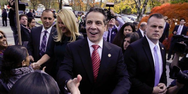 New York Gov. Andrew Cuomo greets supporters and anti-fracking demonstrators after casting his ballot, Tuesday, Nov. 4, 2014, in Mount Kisco, N.Y. A victory by Cuomo over Republican challenger Rob Astorino on Tuesday would make him the first Democratic governor since his father, Mario Cuomo, to win re-election in the nation's third-largest state. (AP Photo/Julie Jacobson)