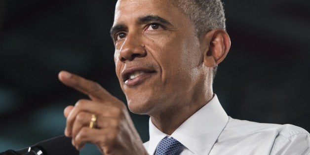 US President Barack Obama speaks about the automotive manufacturing industry at the Ford Michigan Assembly Plant in Wayne, Michigan, January 7, 2015. AFP PHOTO / SAUL LOEB (Photo credit should read SAUL LOEB/AFP/Getty Images)