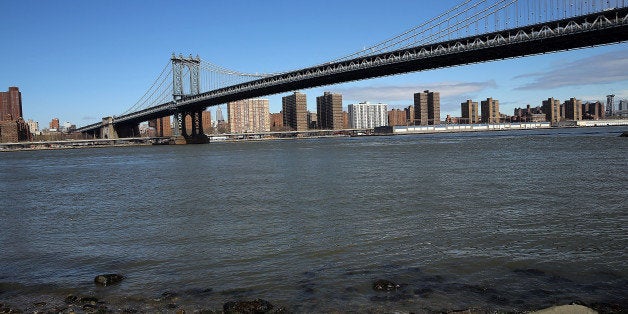 NEW YORK, NY - MARCH 31: The Manhattan Bridge is viewed from a park in Brooklyn that saw severe flooding during Hurricane Sandy on March 31, 2014 in New York City. A new report released Monday by the Intergovernmental Panel on Climate Change, a United Nations group that summarizes climate science, gave a dire picture of the earth's slow warming due to greenhouse gases and other human based behaviors. The report warned that countries and cities located along the coastline face a particular danger as the oceans continue to rise resulting in large scale flooding and erosion. (Photo by Spencer Platt/Getty Images)