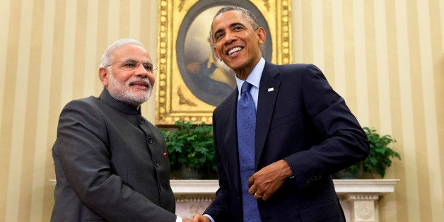 President Barack Obama shakes hands with Indian Prime Minister Narendra Modi, Tuesday, Sept. 30, 2014, in the Oval Office  of the White House in Washington. President Barack Obama and India's new Prime Minister Narendra Modi said Tuesday that "it is time to set a new agenda" between their countries, addressing concerns that the world's two largest democracies have grown apart. (AP Photo/Evan Vucci)