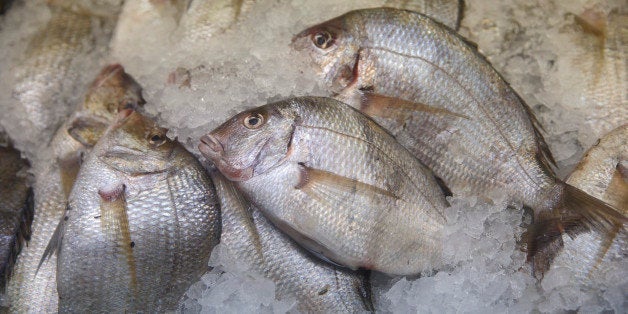 Fish and seafood is displayed for sales at the Eastern Market in Washington, Wednesday, Nov. 26, 2014. (AP Photo/J. Scott A