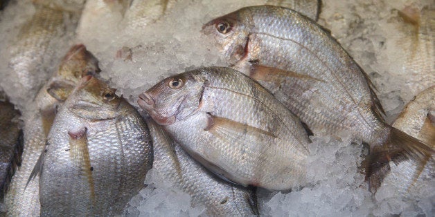 Fish and seafood is displayed for sales at the Eastern Market in Washington, Wednesday, Nov. 26, 2014. (AP Photo/J. Scott Applewhite)