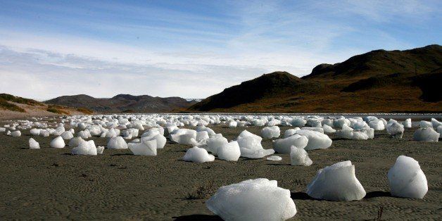 KANGERLUSSUAQ, GREENLAND - SEPTEMBER 01: (ISRAEL OUT) Ice boulders left behind after a flood caused by the overflowing of a lake, east to the town of Kangerlussuaq on September 01, 2007 Greenland. Scientists believe that Greenland, with its melting ice caps and disappearing glaciers, is an accurate thermometer of global warming. (Photo by Uriel Sinai/Getty Images)