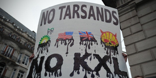 Protesters take part in a rally in central London on April 11, 2013 to demonstrate against the Keystone XL Tar Sands Pipeline as foreign ministers from the G8 group of nations meet nearby. G8 Foreign Ministers will be discussing the situation in Syria, the spiralling North Korean nuclear crisis and Iran's atomic ambitions at their meeting, a prelude to the annual Group of Eight leaders' summit later this year in Northern Ireland. AFP PHOTO/CARL COURT (Photo credit should read CARL COURT/AFP/Getty Images)