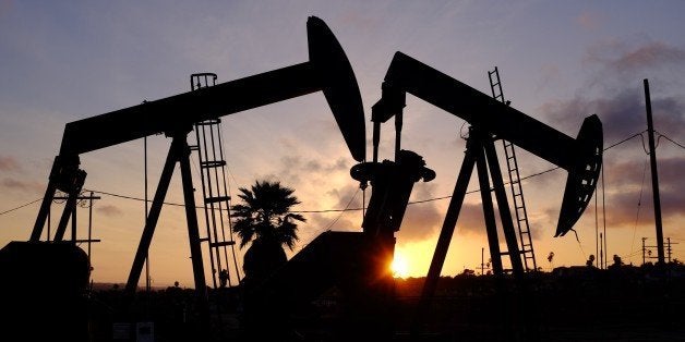 This Thursday March 6, 2014 photo shows the setting sun behind pumpjacks operating at the Inglewood oil fields in the Baldwin Hills area of Los Angeles. The Los Angeles City Council has taken steps to prohibit hydraulic fracturing, or fracking. (AP Photo/Richard Vogel)