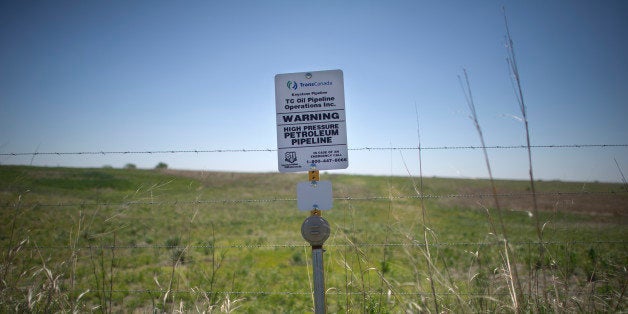 A sign marks the ground covering TransCanada's Keystone I pipeline outside of Steele City, Nebraska. The Keystone XL pipeline is set to meet the first pipeline at this location. From Oil and Water: Following the route of the Keystone XL pipeline through the USA. (Photo by Lucas Oleniuk/Toronto Star via Getty Images)