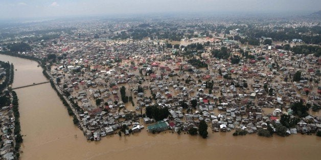 This Tuesday, Sept. 9, 2014 aerial view shows buildings partially submerged in floodwaters in Srinagar, India. The death toll