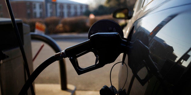 A gasoline nozzle is inserted into a vehicle's gas tank during refueling at a a Royal Dutch Shell Plc gas station in Portland