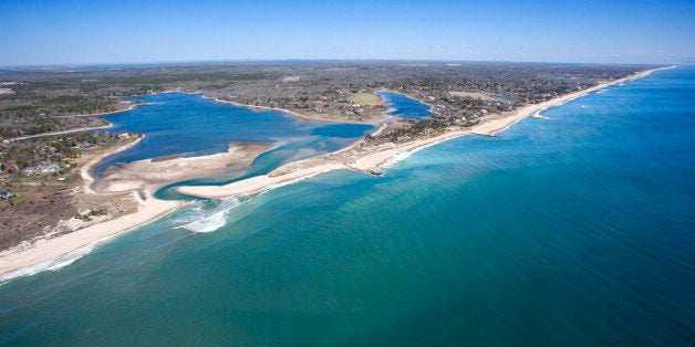 Aerial view of Southampton, New York with shoal and inlet.