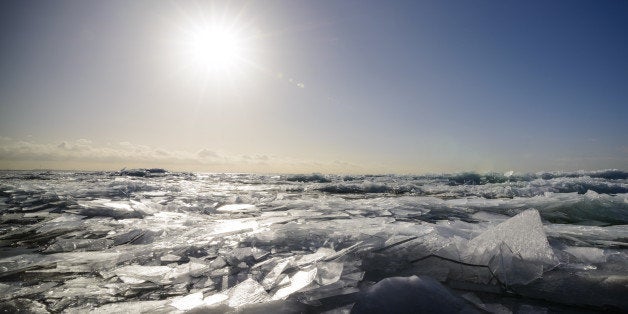 Winter landscape with ice sheets and icebergs.