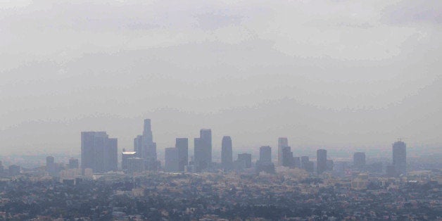In this April 28, 2009 file photo, smog covers downtown Los Angeles. A new study in the journal Nature finds that while U.S.