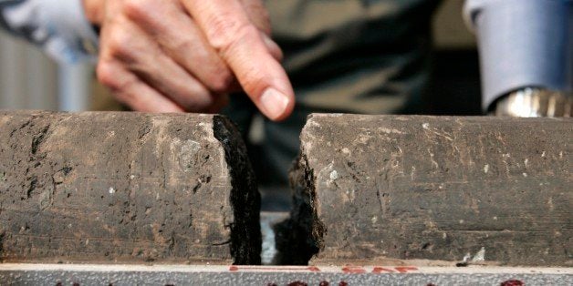 Mark Zoback, a geophysicist at Stanford University, shows off rock samples from two miles beneath the surface of the San Andreas Fault during a news conference on the Stanford University campus in Palo Alto, Calif., Thursday, Oct. 4, 2007. Zoback was part of a team of scientists drilling a borehole into the San Andreas fault to better understand how earthquakes are born. (AP Photo/Paul Sakuma)