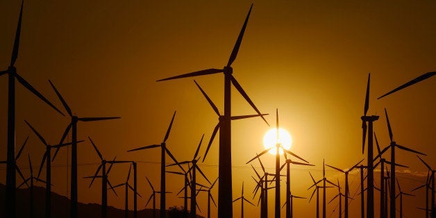 PALM SPRINGS, CA - MARCH 27: Giant wind turbines are powered by strong winds during sunset on March 27, 2013 in Palm Springs, California. According to reports, California continues to lead the nation in green technology and has the lowest greenhouse gas emissions per capita, even with a growing economy and population. (Photo by Kevork Djansezian/Getty Images)