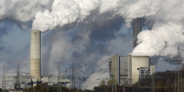Part of a coal burning power plant with pollution.