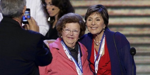 Sen. Barbara Mikulski, D-Md., left, and Sen. Barbara Boxer, D-Calif., right, pause for a souvenir photo as they preview the stage before the start of day two of the Democratic National Convention, in Charlotte, N.C., Wednesday, Sept. 5, 2012. (AP Photo/J. Scott Applewhite)