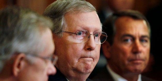 FILE - In this June 16, 2010 file photo, Senate Minority Leader Mitch McConnell of Ky., center, flanked by House Minority Leader John Boehner of Ohio, right, and Senate Majority Leader Harry Reid of Nev., is seen on Capitol Hill in Washington. Crafting an agenda for the fall elections has not been easy for congressional Republicans, who, to solicit ideas, set up a Web site, soon flooded by liberals with distinctly un-Republican suggestions. Meanwhile some Republicans don't even agree that they need a new agenda at all. (AP Photo/Carolyn Kaster, File)