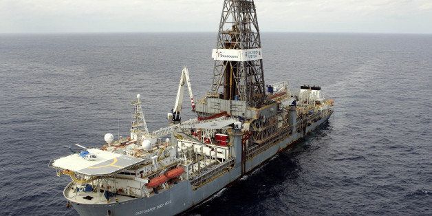 ** ADVANCE FOR FRIDAY JUNE 16 **The Discoverer Deep Seas drillship sits stationary as Chevron drills for oil off the coast of Louisiana in the Gulf of Mexico on Tuesday March 28, 2006. Nearly three football fields long, the ship appears to be sitting idle on the Gulf of Mexico, while a 200-person crew works around the clock, controlling an adjoining oil rig. It's the kind of deepwater discovery once thought to be out of reach, but with improved technology and climbing global oil prices, companies are spending billions developing oil fields that will substantially boost Gulf production. (AP Photo/Alex Brandon)