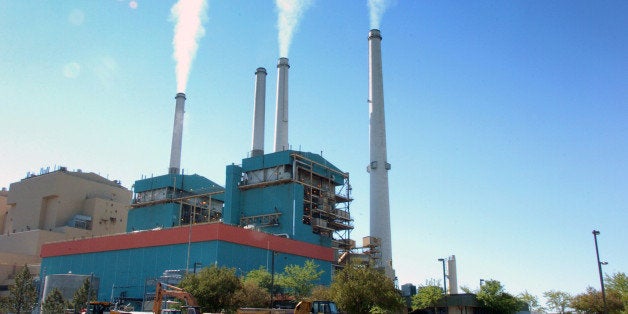 FILE - In this July 1, 2013, file photo, smoke rises from the Colstrip Steam Electric Station, a coal burning power plant in