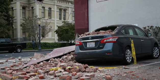 NAPA, CA - AUGUST 24: Bricks from a damaged building sit on a car following a reported 6.0 earthquake on August 24, 2014 in