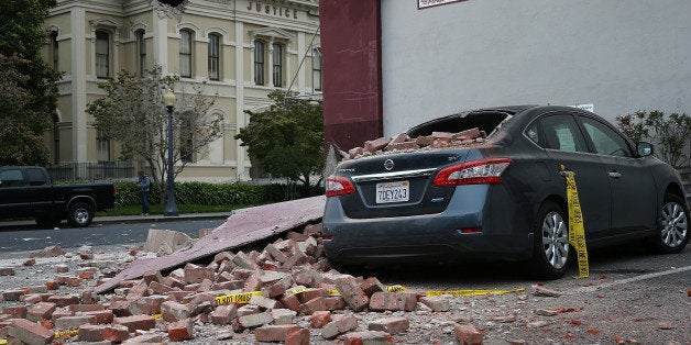 NAPA, CA - AUGUST 24: Bricks from a damaged building sit on a car following a reported 6.0 earthquake on August 24, 2014 in Napa, California. A 6.0 earthquake rocked the San Francisco Bay Area shortly after 3:00 am on Sunday morning causing damage to buildings and sending at least 70 people to a hospital with non-life threatening injuries. (Photo by Justin Sullivan/Getty Images)