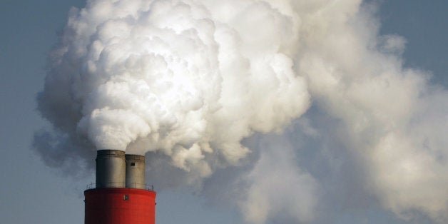 A chimney spews emissions at a power station at the recently opened China (Shanghai) Pilot Free-Trade Zone in Shanghai on Nov