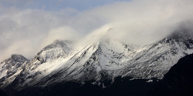 mist and clouds rolling over snow covered mountain tops outside ushuaia patagonia tierra del fuego argentina