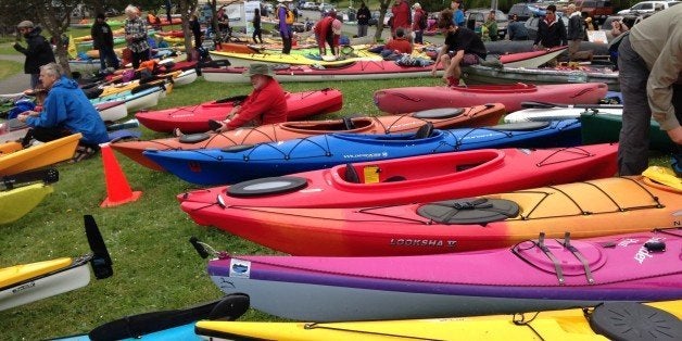 Activists who oppose Royal Dutch Shell's plans to drill for oil in the Arctic Ocean prepare their kayaks for the "Paddle in Seattle" protest on Saturday, May 16, 2015, in Seattle. The protesters gathered at a West Seattle park and then joined hundreds of others in Elliott Bay, next to the Port of Seattle Terminal 5, where Shell's Polar Pioneer drilling rig is docked. (AP Photo/Martha Bellisle)