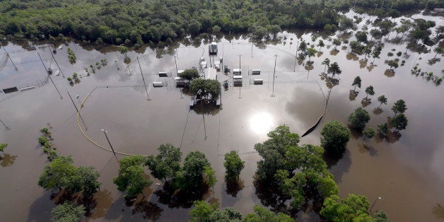 Baseball fields Bear Creek Park are covered by floodwaters Saturday, May 30, 2015, in Houston. The Colorado River in Wharton and the Brazos and San Jacinto rivers near Houston are the main focus of concern as floodwaters moved from North and Central Texas downstream toward the Gulf of Mexico. (AP Photo/David J. Phillip)