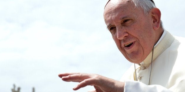 Pope Francis gestures as he leaves St Peter's square at the end of his weekly general audience at the Vatican on May 27, 2015. AFP PHOTO / ALBERTO PIZZOLI (Photo credit should read ALBERTO PIZZOLI/AFP/Getty Images)