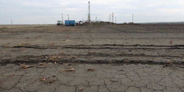 BAKERSFIELD, CA - FEBRUARY 6: Workers drill for water for a farmer on February 6, 2014 near Bakersfield, California. Now in its third straight year of unprecedented drought, California is experiencing its driest year on record, dating back 119 years and possible the worst in the past 500 years. Grasslands that support cattle have dried up, forcing ranchers to feed them expensive supplemental hay to keep them from starving or to sell at least some of their herds, and farmers are struggling with diminishing crop water and whether to plant or to tear out permanent crops which use water year-round like almond trees. About 17 rural communities could run out of drinking water within several weeks and politicians are pushing to undo laws that protect several endangered species. (Photo by David McNew/Getty Images)