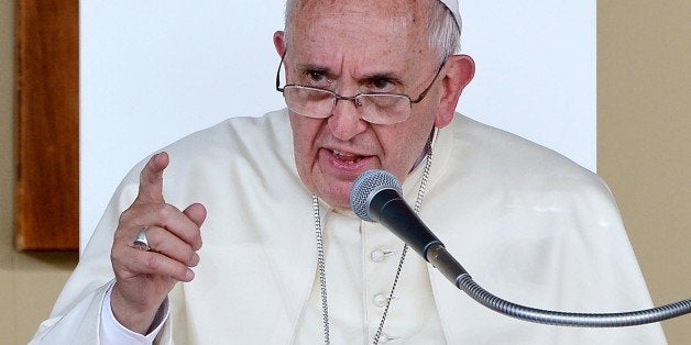 Pope Francis gestures as he speaks during a meeting with the youth on Piazza Vittorio in Turin on June 21, 2015. The pontiff is on a visit to Turin to venerate the Holy Shroud, believed by some Christians to be the burial shroud of Jesus of Nazareth, after which the pope will meet prisoners, young people and the sick in his first pastoral trip to northern Italy. AFP PHOTO / ALBERTO PIZZOLI (Photo credit should read ALBERTO PIZZOLI/AFP/Getty Images)