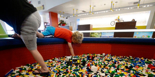CARLSBAD, CA - SEPTEMBER 17: Children play with Lego blocks in the lobby of North America's first ever Legoland Hotel at Lego