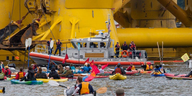 SEATTLE, WA - MAY 16: A U.S. Coast Guard vessel keeps watch over ShellNo flotilla participants as they float in front of the Polar Pioneer oil drilling rig during demonstrations against Royal Dutch Shell on May 16, 2015 in Seattle, Washington. On Saturday demonstrators began three days of protests both on land and on Puget Sound over the presence of the Royal Dutch Shell oil rig in the Port of Seattle. (Photo by David Ryder/Getty Images)