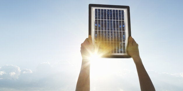 Woman hands with solar panel