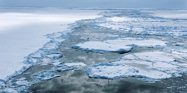 Antarctica, Weddell Sea, Ice floe, clouds reflecting in water