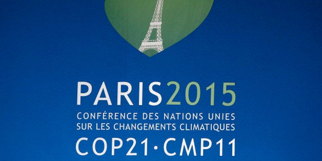 The logo of the upcoming COP21 Climate Conference is seen at the Elysee Palace during a meeting with African Leaders in Paris