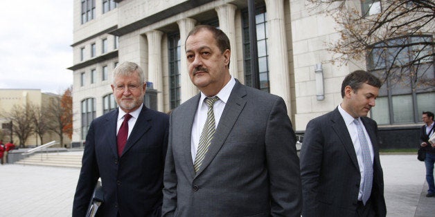 Donald 'Don' Blankenship, former chief executive officer of Massey Energy Co., center, and his attorney Bill Taylor, left, ex