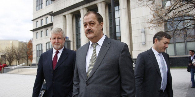 Donald 'Don' Blankenship, former chief executive officer of Massey Energy Co., center, and his attorney Bill Taylor, left, exit the Robert C. Byrd U.S. Courthouse in Charleston, West Virginia, U.S., on Thursday, Dec. 3, 2015. Blankenship, one of Appalachias last coal barons, was found guilty of plotting to speed up production by ignoring safety rules at a company mine that later blew up killing 29 workers. Photographer: Calvin Mattheis/Bloomberg via Getty Images 