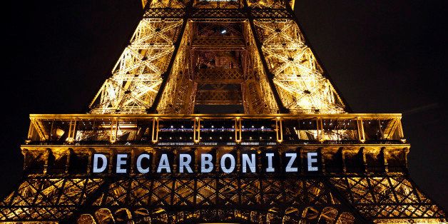 PARIS, FRANCE - DECEMBER 11: The slogan 'Decarbonize' is projected on the Eiffel Tower as part of the World Climate Change Conference 2015 (COP21) on December 11, 2015 in Paris, France. COP21 President Laurent Fabius unveiled the final draft text of a global climate agreement of negotiations in Paris. (Photo by Chesnot/Getty Images)