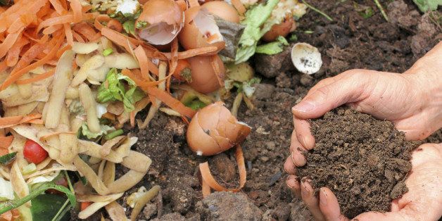 Hands are holding composted earth.