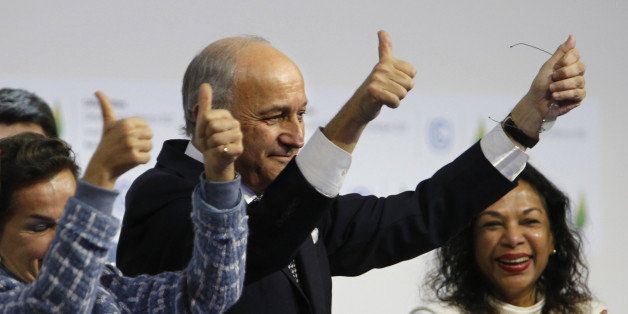 Foreign Affairs Minister and President-designate of COP21 Laurent Fabius gestures after adoption of a historic global warming pact at the COP21 Climate Conference in Le Bourget, north of Paris, on December 12, 2015. Envoys from 195 nations on December 12 adopted to cheers and tears a historic accord to stop global warming, which threatens humanity with rising seas and worsening droughts, floods and storms. AFP PHOTO / FRANCOIS GUILLOT / AFP / FRANCOIS GUILLOT (Photo credit should read FRANCOIS GUILLOT/AFP/Getty Images)