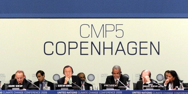 Executive-Secretary of the UN Climate Conference, Yvo de Boer (L) and UN Secretary-General Ban Ki-Moon attend the plenary session at the Bella Center of Copenhagen on December 19, 2009 at the end of the COP15 UN Climate Change Conference. Fury erupted among delegates at the Copenhagen climate talks, today over a draft accord agreed by a select group of leaders, with several poor nations saying it amounted to a coup d'etat against the United Nations. AFP PHOTO / OLIVIER MORIN (Photo credit should read OLIVIER MORIN/AFP/Getty Images)