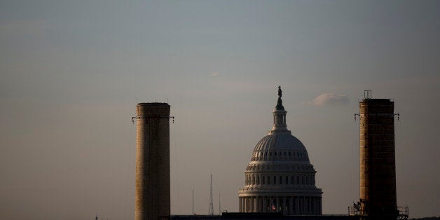 The U.S. Capitol Building stands past the natural gas and coal fueled Capitol Power Plant, which provides heating and cooling